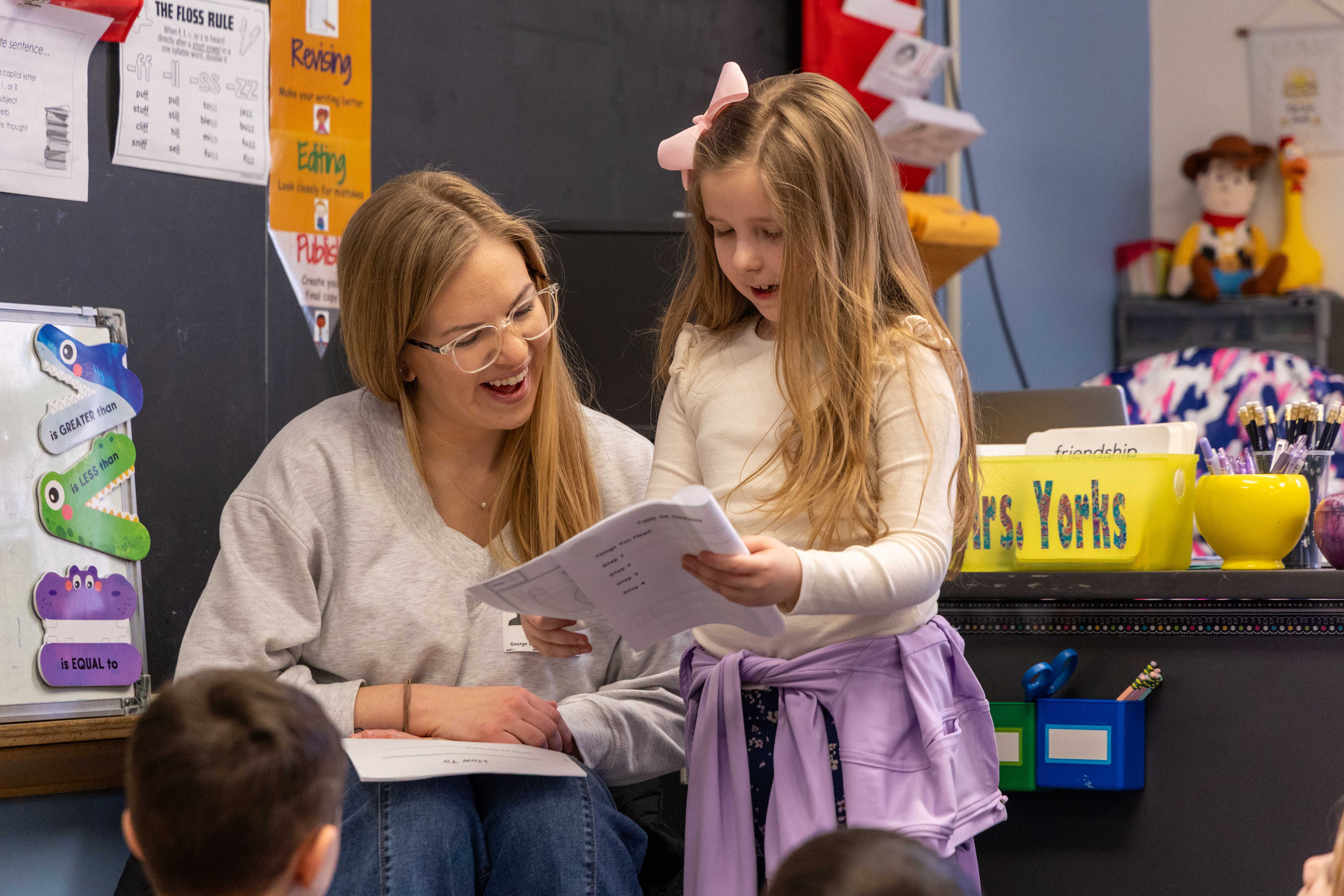 Benson reads with a young student